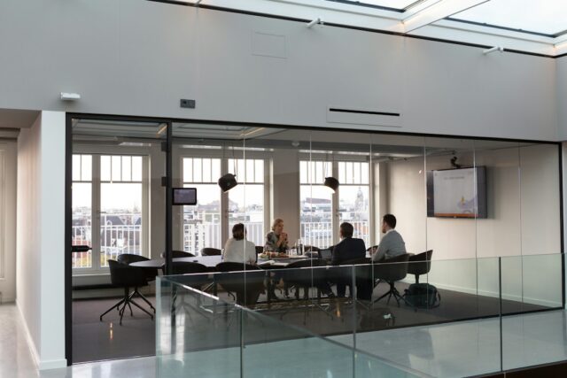 Illustrative photograph of a business meeting, not the IMF and World Bank annual meetings